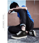 Tênis de lona de cano alto masculino deslizamento-on rendas casuais all-preto sapatos de skate básicos para estudantes sola plana sapatos esportivos confortáveis