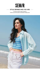 Camisa Feminina Semir com Proteção UV 2026, Texturizada, Lisa, Ombro Caído, Estilo Urbano Casual para o Dia a Dia, Macia e Confortável