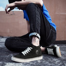 Tênis de lona de cano alto masculino deslizamento-on rendas casuais all-preto sapatos de skate básicos para estudantes sola plana sapatos esportivos confortáveis
